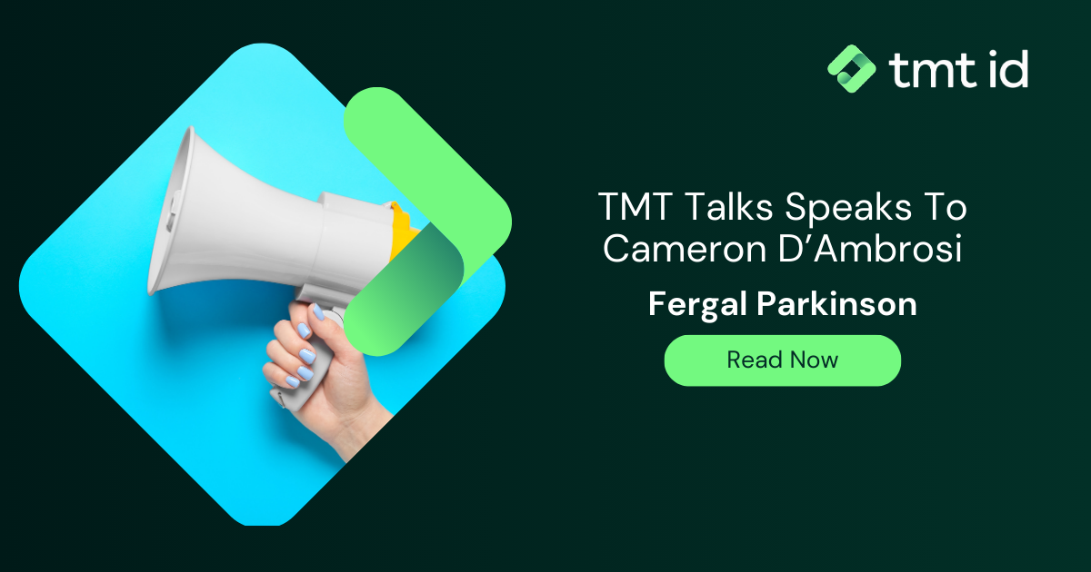 Promotional banner for 'TMT Talks' featuring an interview with Cameron D'Ambrosi and Fergal Parkinson, highlighted by a graphic of a hand holding a megaphone.